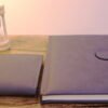 Combination of grey leather wallet with note book