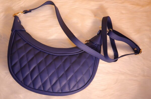 Quilted leather moon shaped Blue sling bag