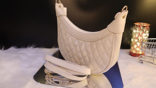 Quilted leather moon shaped white sling bag
