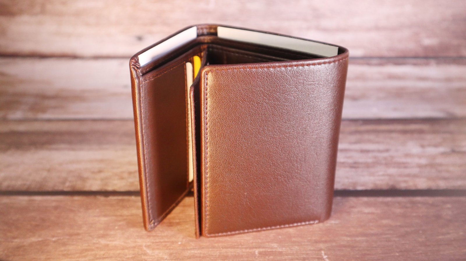 Triple fold brown wallet