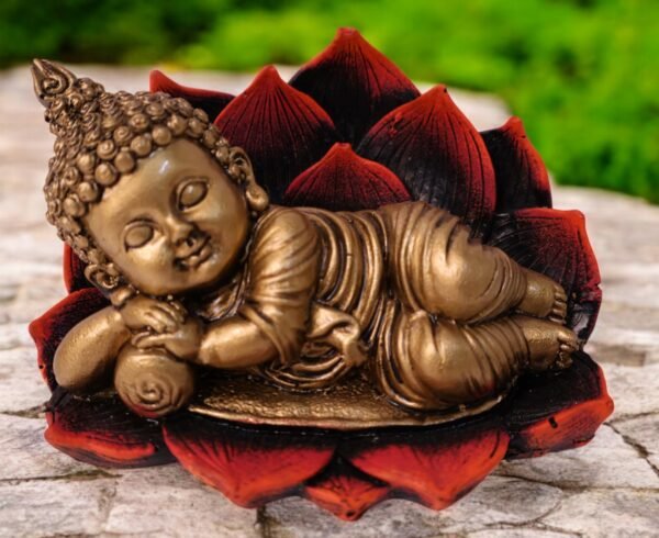 A beautiful statue of baby buddha sleeping on a lotus made up of polyresin