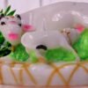 Cow and calf made up of marble dust.