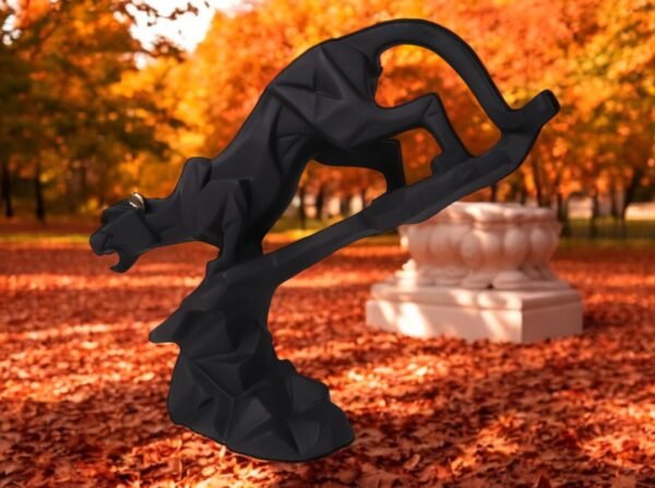 Sculpture of a black panther descending on a rock. ideal for gifting and decoration