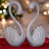 White swan sculpture made up of polyresin and finished with golden color at edges and beak. Ideal for home decor and gifting