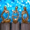 Three Wise Golden Figurines – Abstract Polyresin Sculpture Set