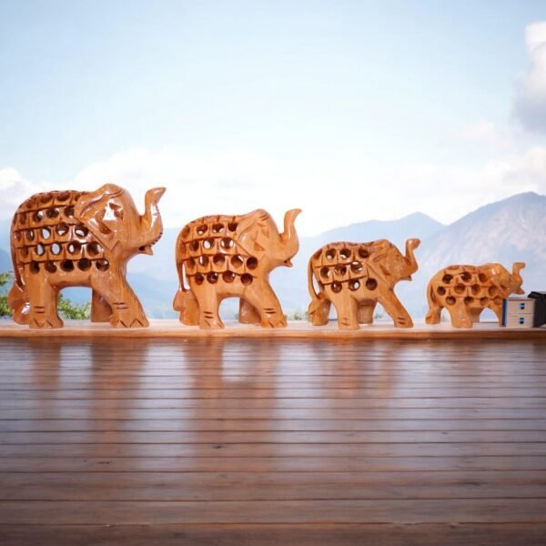 Elephant family sculptures having mesh body madeup of wood.