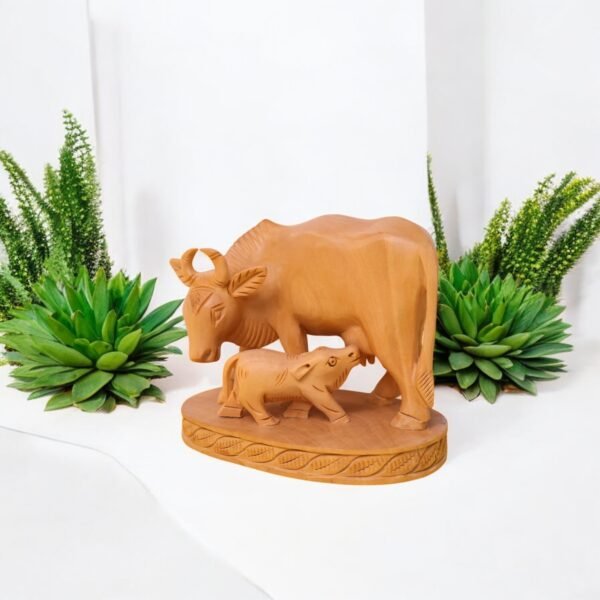 Solid wood cow and calf carved from single piece of wood